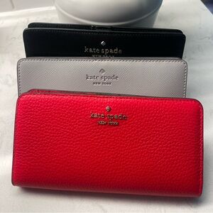 Three authentic Kate Spade slim bifold wallets AND one Maui Jim Sunglasses!!